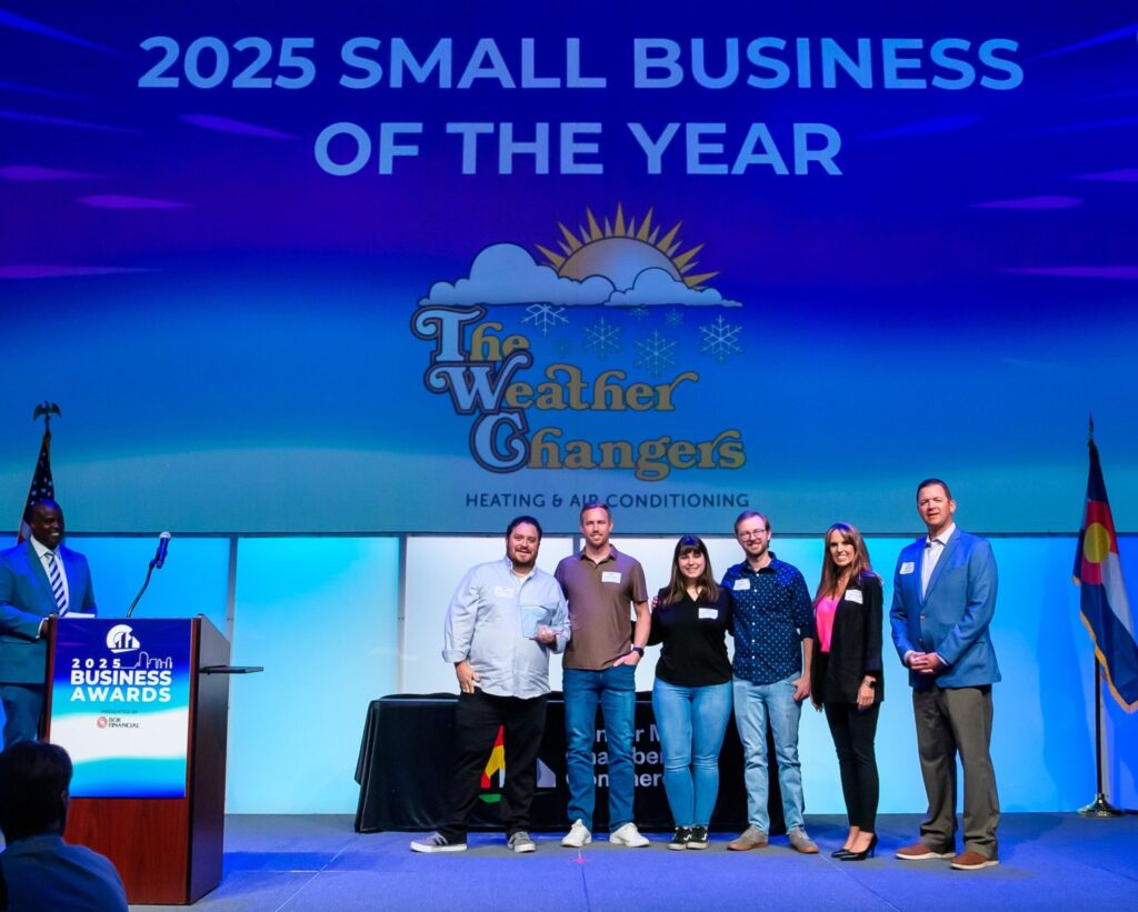 The Weather Changers team accepting the Small Business of the Year award
